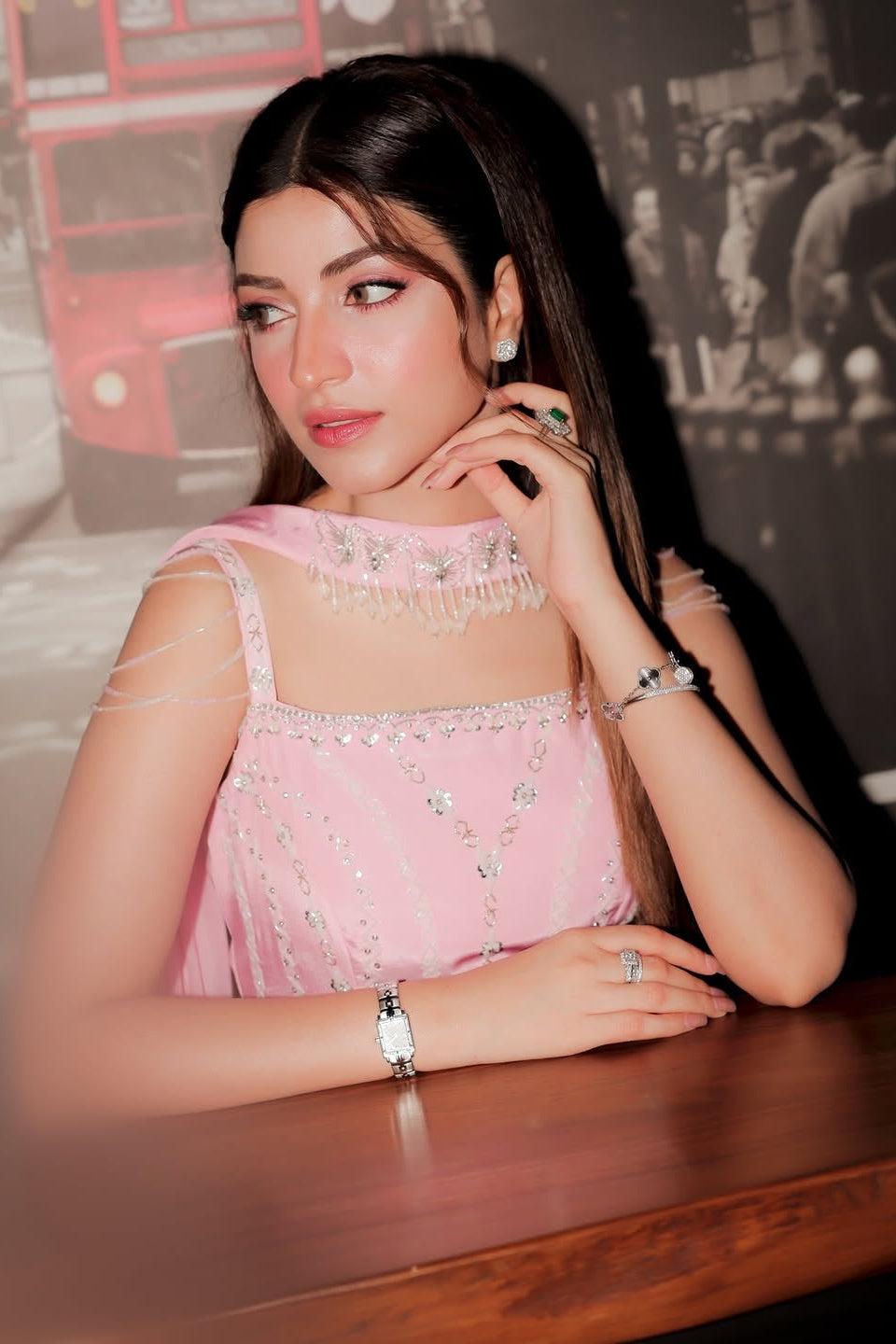 Woman in a pink saree with a blurred background