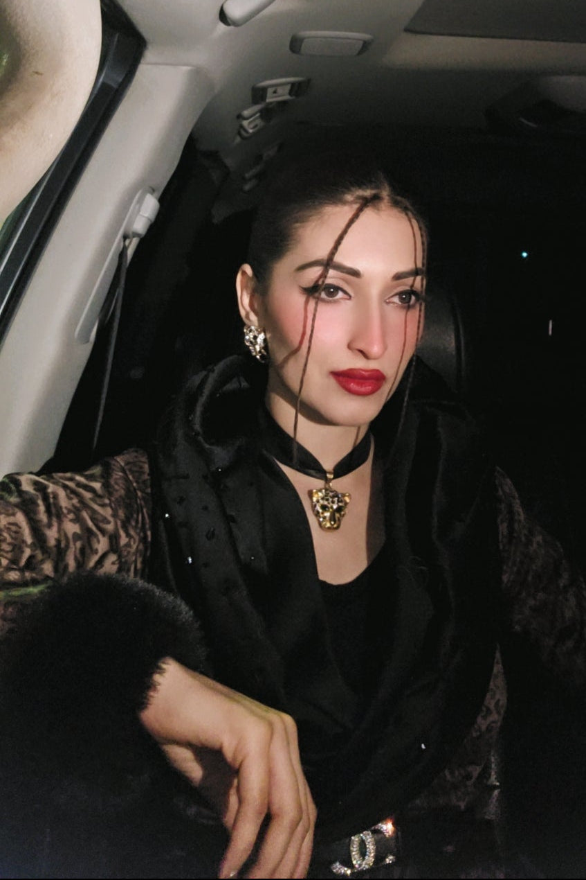 Woman sitting inside a car at night